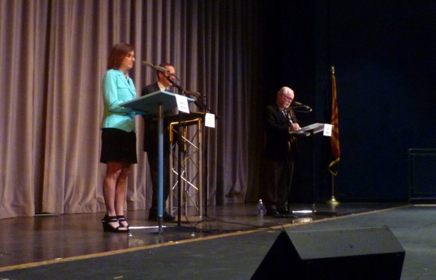 Congressional candidates Democrat Ron Barber and Republican Martha McSally debate in Sierra Vista, Ariz., on Tuesday. The economy and Fort Huachuca, Sierra Vistas military base, were focal points in the evenings debate.