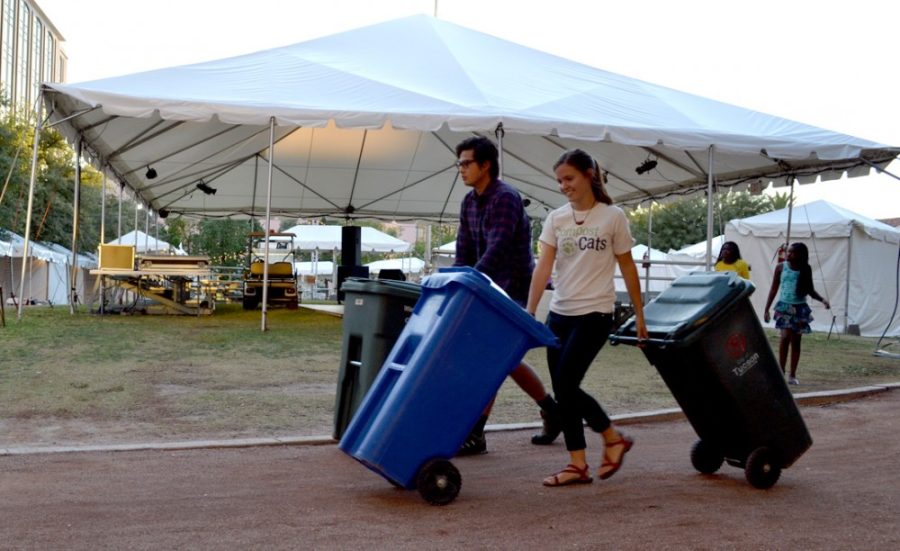 Taylor Sanders (right), a junior studying plant sciences,Spanish and Portuguese, and Ward Austin (left), agricultural business management junior, team up to bring eco-friendly Green Stations to the Tucson Meet Yourself festival. Each Green Station consists of composting, recycling and landfill bins attended by two Green Team members.