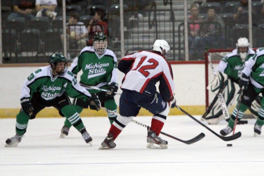 Arizona right wing Alex Nespor (12) skates toward the goal during Arizonas 4-2 win against Michigan State on Nov. 7. Nespor and the Wildcats host NAU and Minot State this weekend in the final two games of a nine-game home stand.
