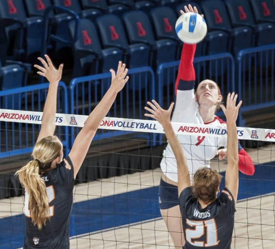 <p>Courtesy of Arizona Athletics</p><p>Arizona volleyball outside hitter Madi Kingdon spikes the ball past Oregon State's defense during Arizona's 3-1 win on Sunday in McKale Center. Kingdon and the Wildcats hit the road this weekend to face the Washington schools.</p>