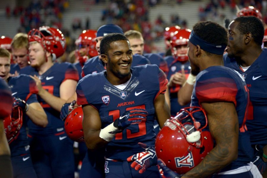 Arizona+cornerback+Devin+Holiday+celebrates+the+Wildcats+38-20+win+over+Colorado+on+Saturday.+Holiday+and+the+WIldcats+currently+trail+Arizona+State+and+UCLA+in+the+Pac-12+South+race.
