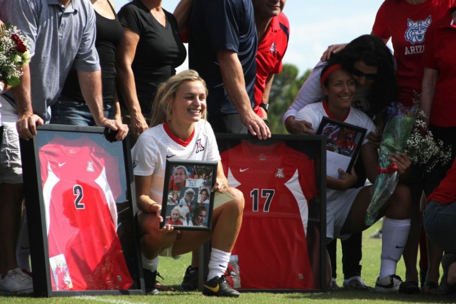 Arizona soccer forward Alexandra Doller (2) and midfielder LeeAndra Smith (17) are recognized during senior day on Oct. 26 at Murphey Field at Mulcahy Soccer Stadium. Doller, Smith and the Wildcats play against a familiar Texas A&M team this weekend in the second round of the NCAA tournament.