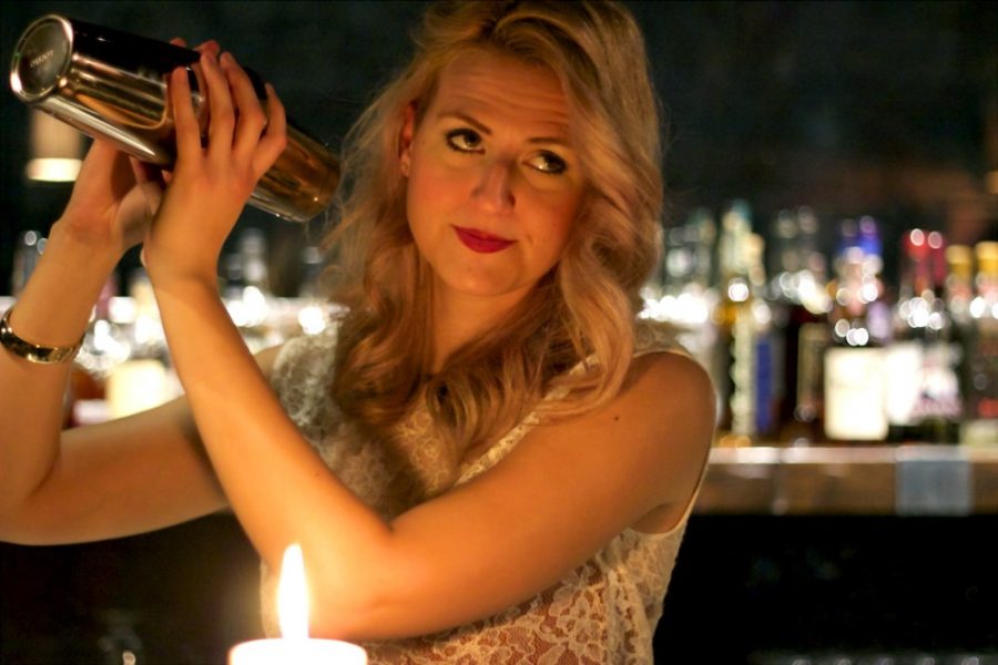While lit by the romantic candlelight, Tiffany Eldredge shakes a drink at The Still.