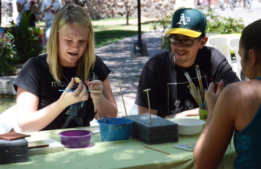 Rebecca Noble / The Daily Wildcat

Taylor Wagner (left), a senior in nutrition, Francisco Rodriguez (center), a sophomore in behavioral sciences, and Jacquelyn Hinek (right), a sophomore in psychology, volunteer at Bens Bells in Geronimo Plaza on Tuesday, May 6th. 