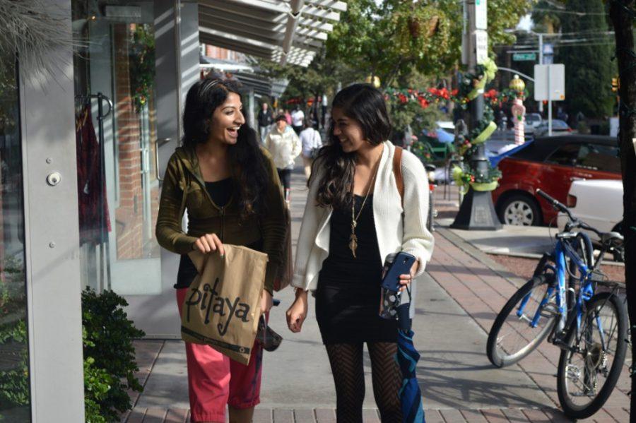 Regan Norton/ The Daily Wildcat

Charnjeet Khaira (left) and Shivani Narang (right) walk down University Boulevard after shopping at Pitaya on Thursday, Dec. 4.