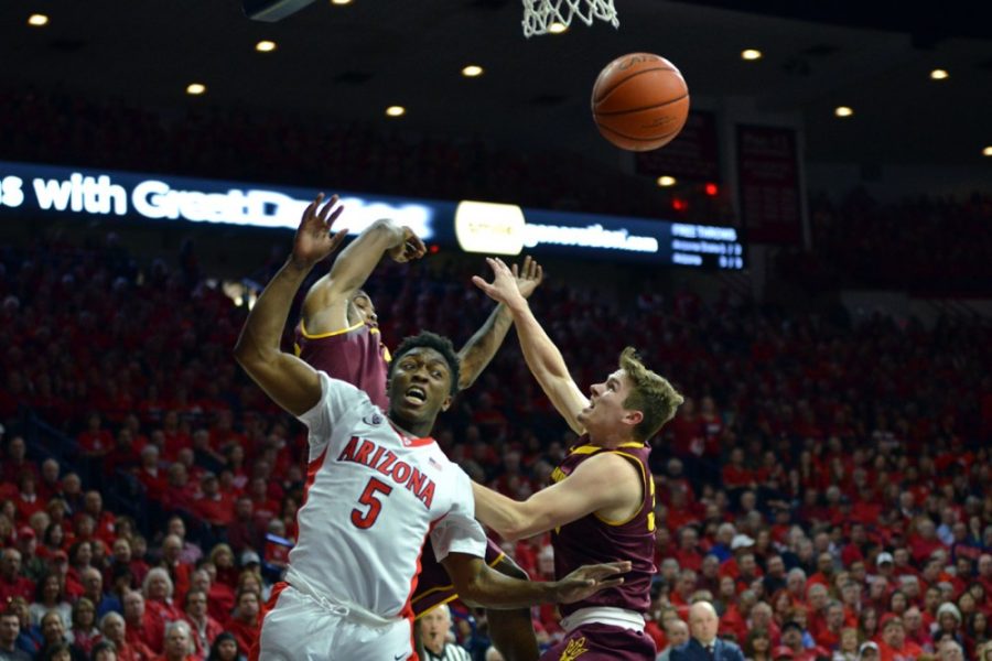 Arizona forward Stanley Johnson watches as his shot is blocked by ASUs  defense during Arizonas 73-49 win against ASU in McKale Center on Jan.  4. Increased offensive output from Johnson could be the boost Arizona  needs to get over its recent struggles.