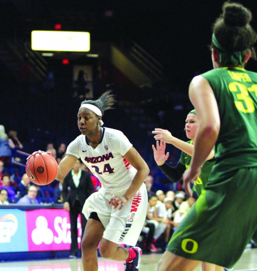 Arizona womens basketball forward LaBrittney Jones (24) drives past  Oregon guard Katelyn Loper (31) during Arizonas 81-78 victory on Sunday  in McKale Center. Jones has transitioned well into a reserve role for  Niya Butts squad and played a key part in the victory over Oregon.