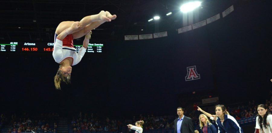 <p>Tyler Baker / The Daily Wildcat</p><p>Arizona gymnast Allison Flores  performs her floor routine during Arizona's win over Illinois-Chicago,  Sacramento State and Wisconsin-Stout inMcKale Center on Friday. Flores  finished first in the floor portion of the quad meet.</p>