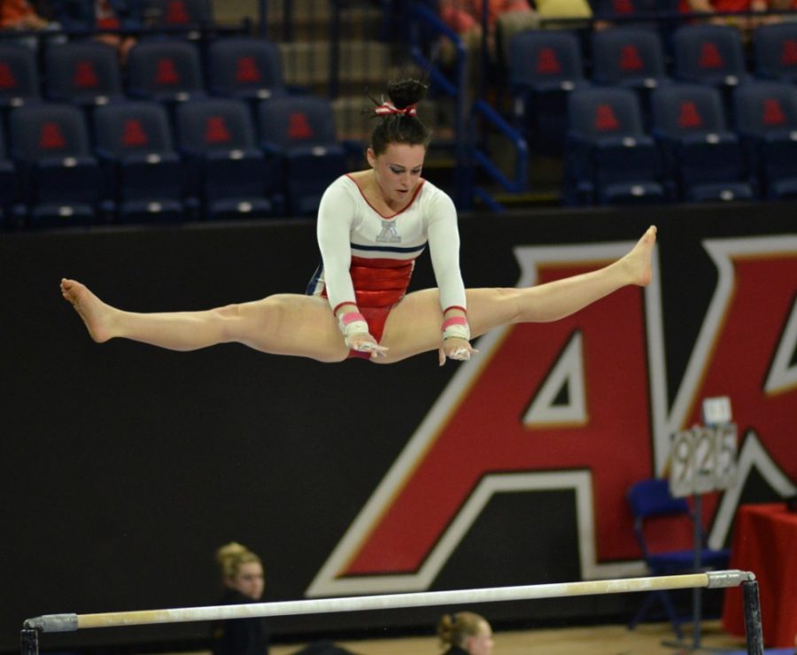 Arizona+gymnast+Victoria+Ortiz+performs+her+high+bar+routine+during++Arizonas+win+over+Illinois-Chicago%2C+Sacramento+State+and++Wisconsin-Stout+in+McKale+Center+on+Jan.+16.+Ortiz+is+among+a+trio+of++freshmen+that+have+helped+out+the+GymCats+this+season.