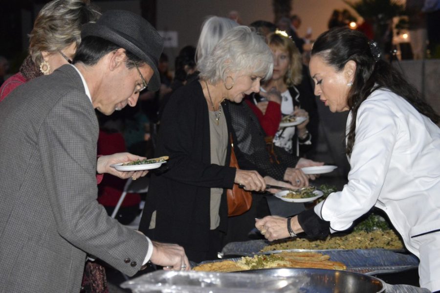 Chef Lisa Dahl, from Dahl & Di Luca Ristorante Italiano in Sedona,  Ariz., serves community members Mediterranean food during the opening  night of A Food, Wine, and Healthy Living Event, at the Tucson Museum  of Art on Wednesday. The 2015 Research Frontiers in Nutritional Sciences  Conference, hosted by the department of nutritional sciences, focuses  on educating people about the benefits of the Mediterranean diet.