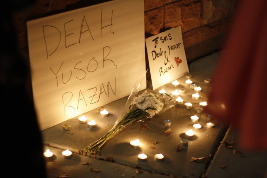 A candle lit vigil is held on the University of Arizona mall Thursday evening, Feb. 12, 2015. The gathering was in honor of three muslim students killed in Chapel Hill, North Carolina.