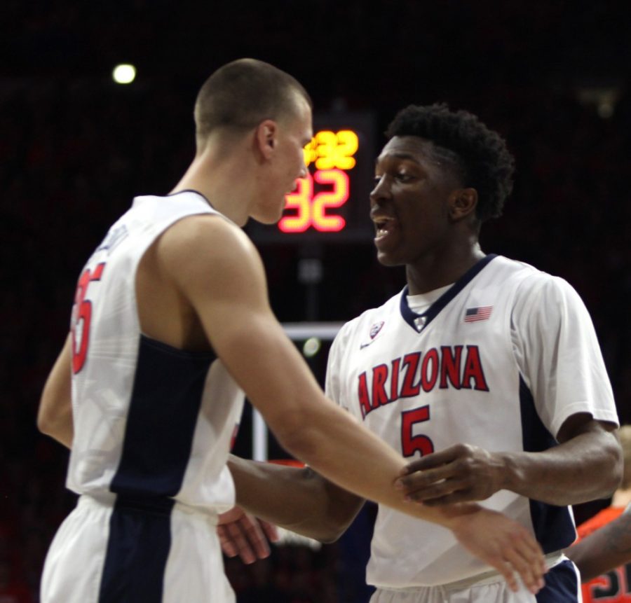 Arizona+mens+basketball+center+Kaleb+Tarczewski+%2835%29+and+forward++Stanley+Johnson+%285%29+celebrate+during+Arizonas+57-34+victory+over+Oregon++State+on+Friday+in+McKale+Center.+Arizona+and+Utah+have+taken+a+firm++hold+of+the+Pac-12+Conference+standings+while+the+rest+of+the+conference++has+been+volatile.