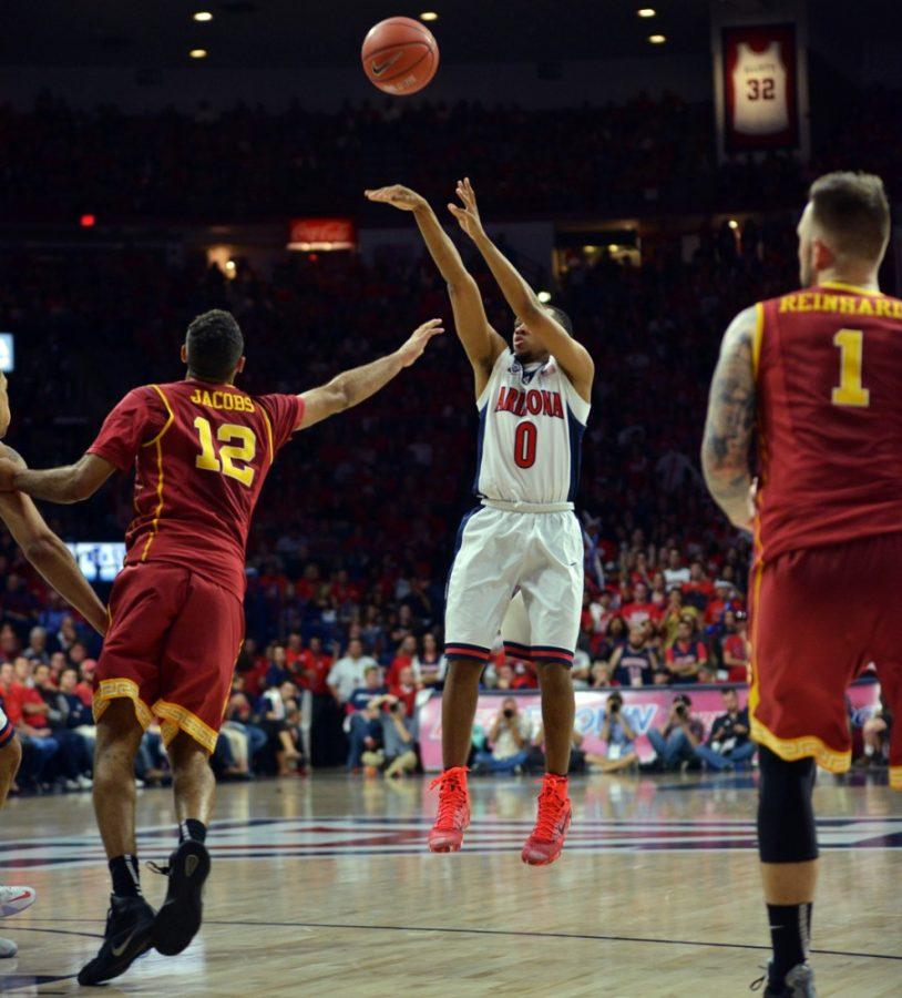 Arizona guard Parker Jackson-Cartwright (0) shoots the ball over USC defense during Arizonas 87-57 win against USC in McKale Center on Thursday.