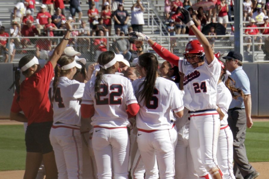 The Arizona softball team revels in its 4-3 win in extra innings against Oklahoma State at Hillenbrand Stadium on Sunday. Arizona swept the Cowgirls over the season-opening, three-game series.
