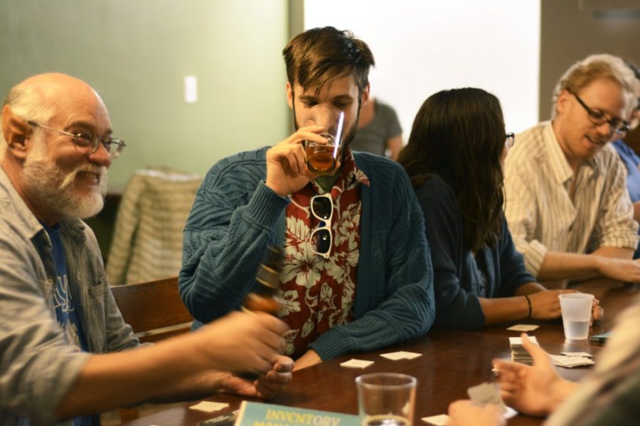 Sydney Richardson / The Daily Wildcat

Zane Forier enjoys a beer while playing Inventory Management at the Maker House on Thursday, Feb. 19, 2015. Inventory Management made its debut at the Maker House on Thursday.