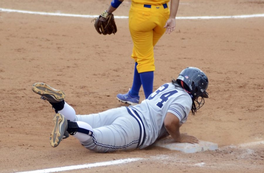 Arizona softball utility Katiyana Mauga (34) slides into third base during Arizonas 9-1 win against San Jose State at Hillenbrand Stadium on Saturday. Mauga and the Wildcats went 6-0 over the weekend to improve to 9-0 on the season.