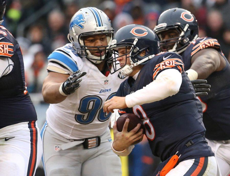 Detroit+Lions+defensive+tackle+Ndamukong+Suh+%2890%29+sacks+Chicago+Bears+quarterback+Jimmy+Clausen+%288%29+during+the+fourth+quarter+on+Sunday%2C+Dec.+21%2C+2014%2C+at+Soldier+Field+in+Chicago.+%28Brian+Cassella%2FChicago+Tribune%2FTNS%29