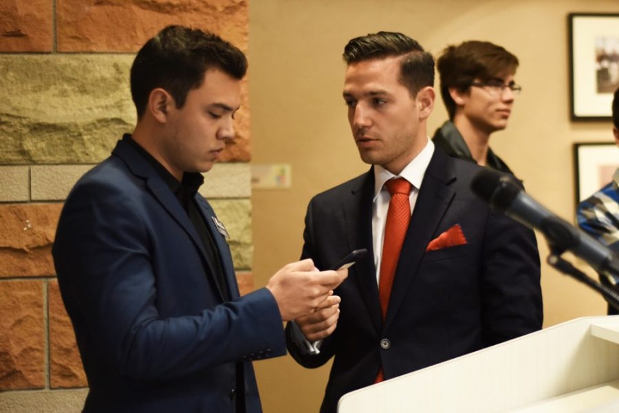 ASUA presidential candidate Manuel Felix (right) speaks with current ASUA election commissioner Diego Alvarez (left) after the announcement of Felixs disqualification during the ASUA election results meeting in the Student Union Memorial Center on March 12. Felixs disqualification has been overturned, and he has been named the official president for the 2015-2016 school year.
