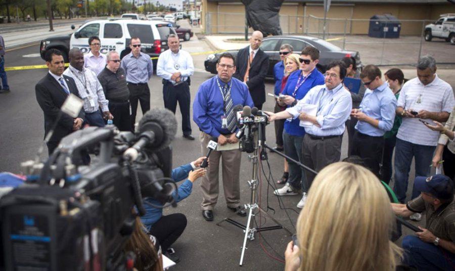 Detective Esteban Flores of the Mesa Police Department gives an update on the capture of a suspected shooter in Mesa, Ariz., on Wednesday, March 18, 2015. (David Jolkovski/East Valley Tribune/TNS)