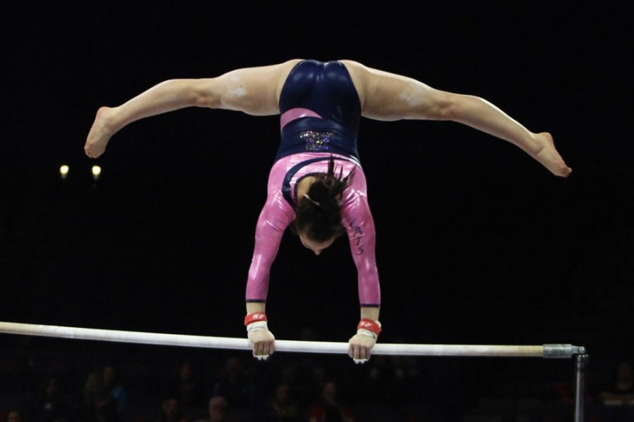 Arizona gymnast Lexi Mills performs her bar routine during Arizonas 196.425-196.000 win against California in McKale Center on Feb. 28. Mills has overcome compartment syndrome to succeed for the Wildcats this season.