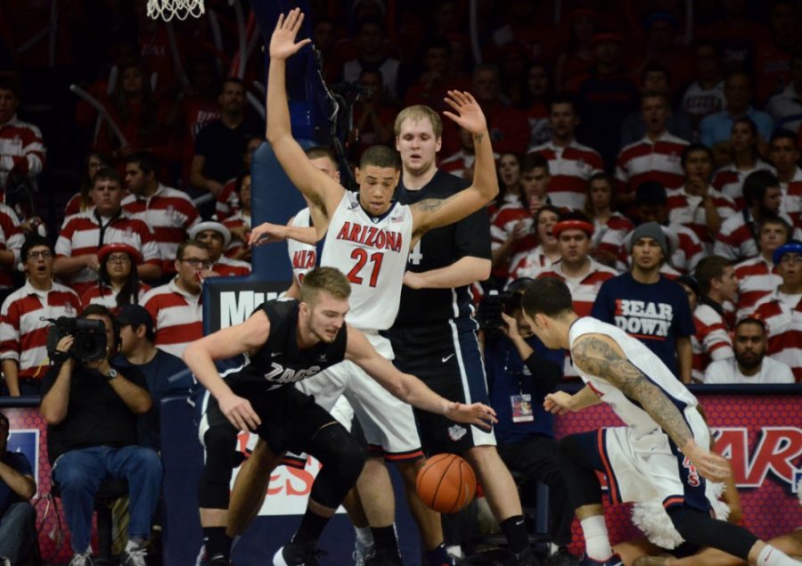 Arizona mens basketball forward Brandon Ashley (21) and guard Gabe York  (right) defend Gonzaga forward Domantas Sabonis (11) during Arizonas  66-63 overtime victory over Gonzaga on Dec. 6 in McKale Center. The  Wildcats defeat of Gonzaga was one of the highlights of the season.