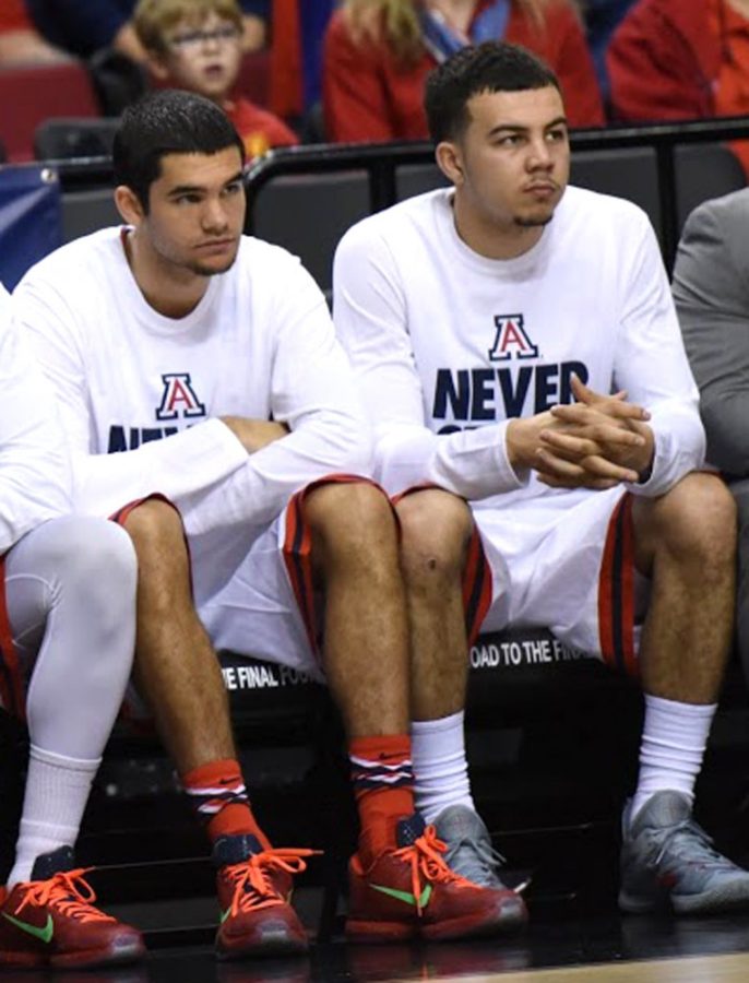 Arizona mens basketball guards Elliott Pitts (left) and Gabe York  (right) watch as Arizona defeats Texas Southern 93-72 during the Round  of 64 in the 2015 NCAA Tournament in Moda Center in Portland, Ore., on  March 19. Pitts and York are two of Arizonas premier bench threats and  huge reasons why Arizona has won 33 games so far this season.