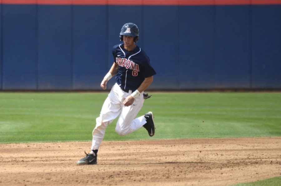 Arizona baseball catcher Riley Moore (6) runs to third base during Arizonas 13-4 win against Oregon at Hi Corbett Field on Sunday afternoon. Moore and the Wildcats have used a dominant offense and revamped pitching staff to already match the win total from last seasons squad.