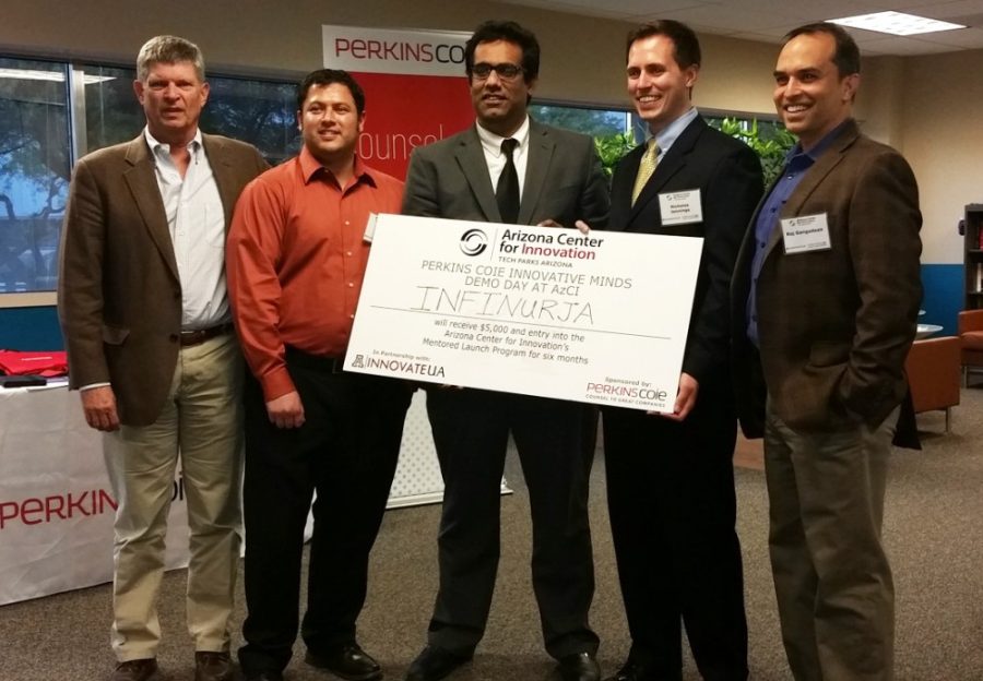 Members of the winning team, Infinurja, pose for a photo with Nicholas Jennings (center right) and Raj Gangadean (far right) for the 2015 Perkins Coie Innovative Minds Challenge Demo Day at the Arizona Center for Innovation on Tuesday. The team was awarded $10,000 for its innovation that converts waste into electricity.