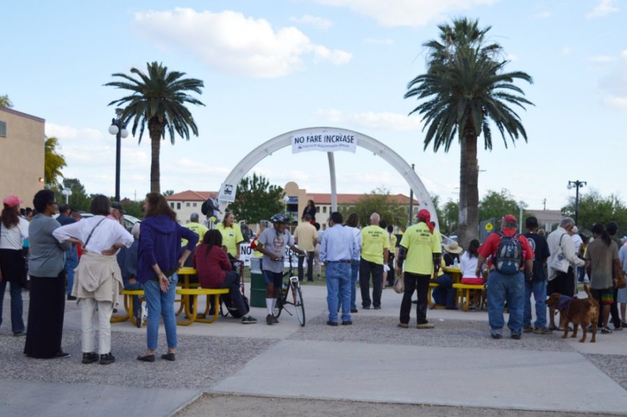 Members of the Tucson Bus Riders Union and Tucson community gather to listen to Jarrett Walker, a public transit planning consultant, at Armory Park on Friday. Walker discussed the importance of low-income fare for Tucsons public transit system.
