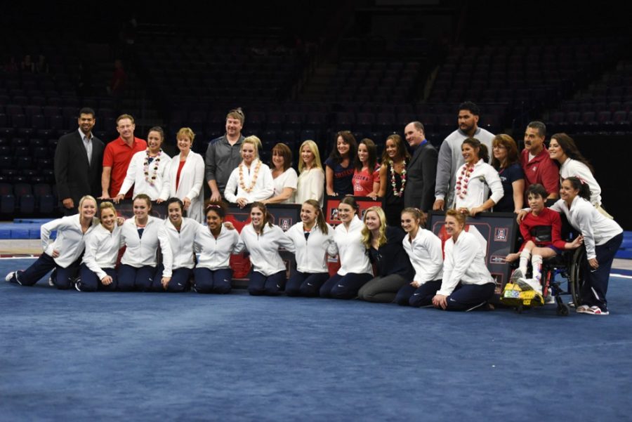The+2015+Arizona+gymnastics+team+poses+for+a+photo+at+the+end+of+the+senior+night+ceremony+after+Arizonas+196.850-196.850+tie+with+Denver+in+McKale+Center+on+March+14.+The+season+was+full+of+highs+and+lows+for+the+Wildcats.