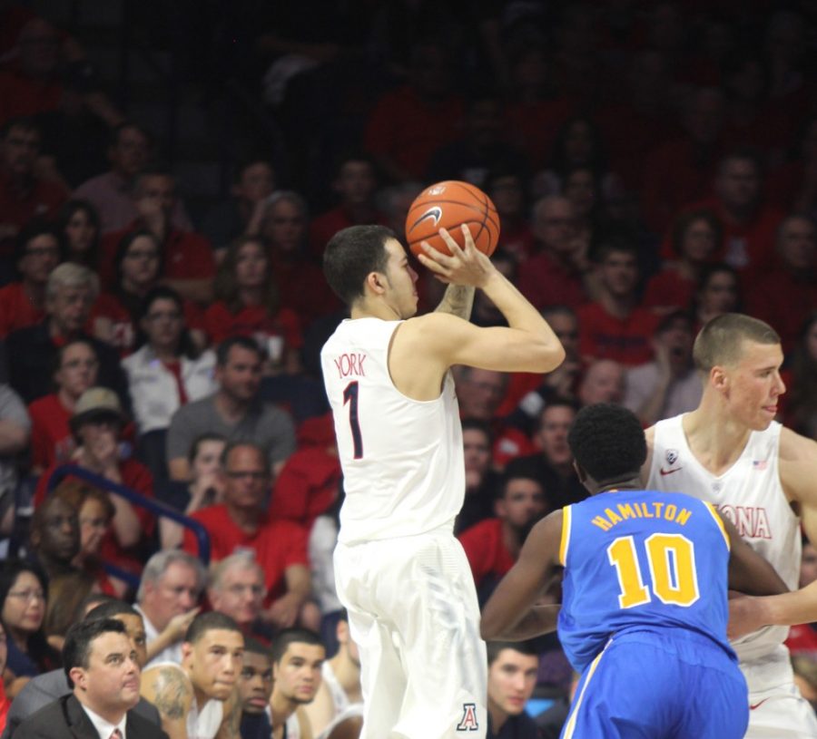 Arizona mens basketball guard Gabe York shoots a 3-pointer while UCLA guard Isaac Hamilton (10) plays defense during Arizonas 57-47 victory over UCLA on Feb. 21 in McKale Center. York and the Wildcats have a chance to make the Elite Eight for a third straight year next season.