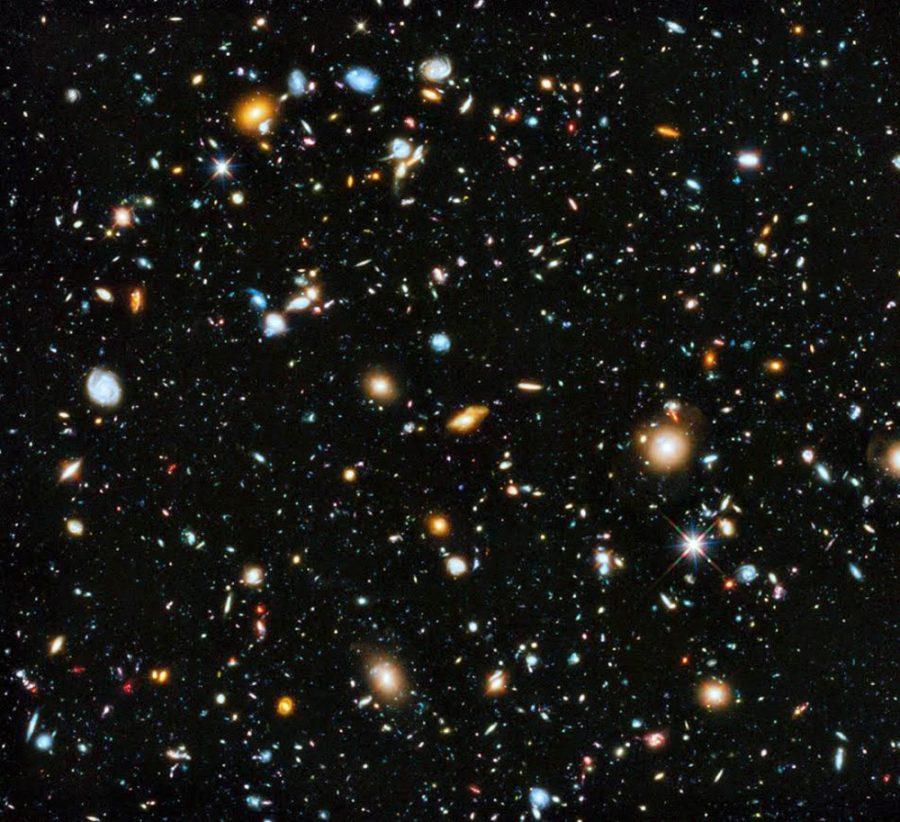 The Hubble Ultra-Deep Field image of distant galaxies. The Hubble Space Telescope allows scientists to see extremely faint objects in the sky. (Courtesy of Rodger Thompson)