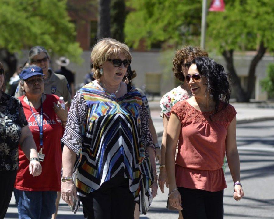 President Ann Weaver Hart (left) speaks with dietitian Christy Wilson during the Hart Walk on Wednesday around the UA campus and Old Main. The afternoon stroll marks the third year of the annual walk series Walks with Campus Leaders.