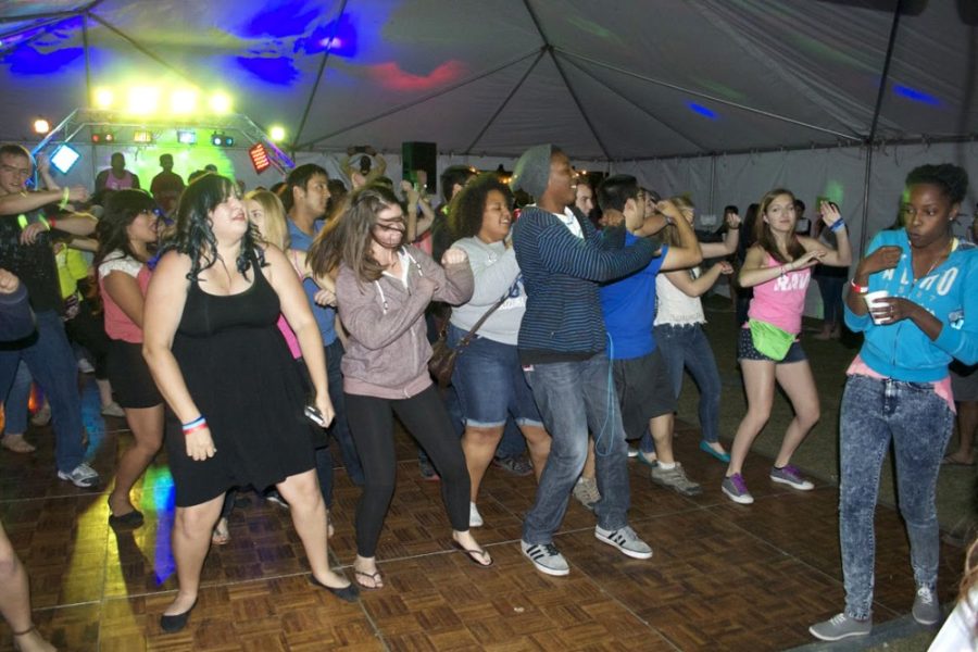 UA students break out dance moves while learning about alcohol awareness at the Residence Hall Associations Rave event on Saturday night on the UA Mall. The event provided alcohol-free beverages for students to enjoy during the event.
