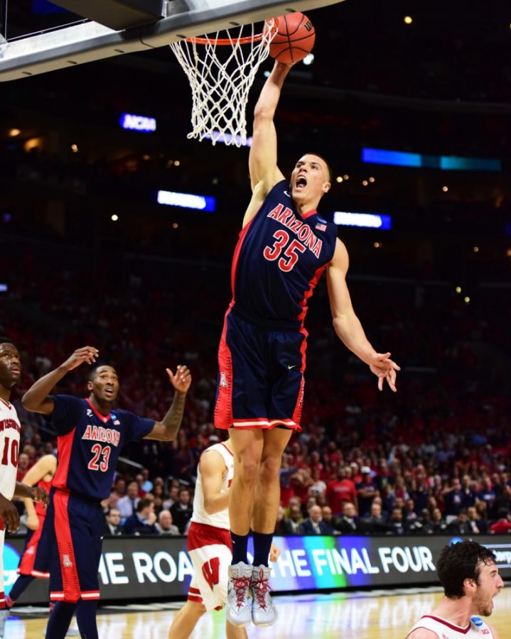 Arizona basketball center Kaleb Tarczewski (35) slams home a dunk during Arizonas 85-78 loss to Wisconsin in the Elite Eight at the Staples Center in Los Angeles on March 28. Despite losing four starters, Tarczewski and the Wildcats should still be a top team in the Pac-12 Conference next season.