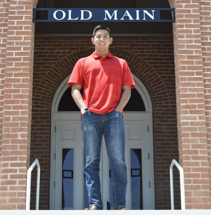 Issac Ortega, a senior studying business and managerial economics, poses in front of Old Main. Ortega served as Associated Students of the University of Arizona president for the 2014-2015 school year and will be graduating in just a few days.