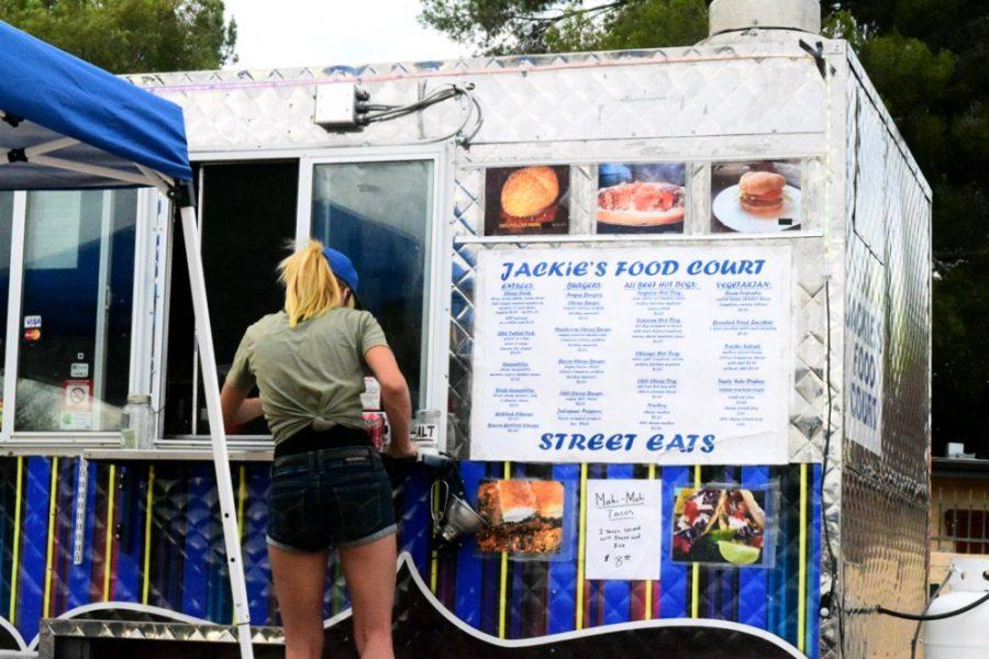 Sally Lugo /  Arizona Summer WildcatA patron orders food from Jackies Food Court during Food Truck Friday at the Downtown Clifton on June 5.