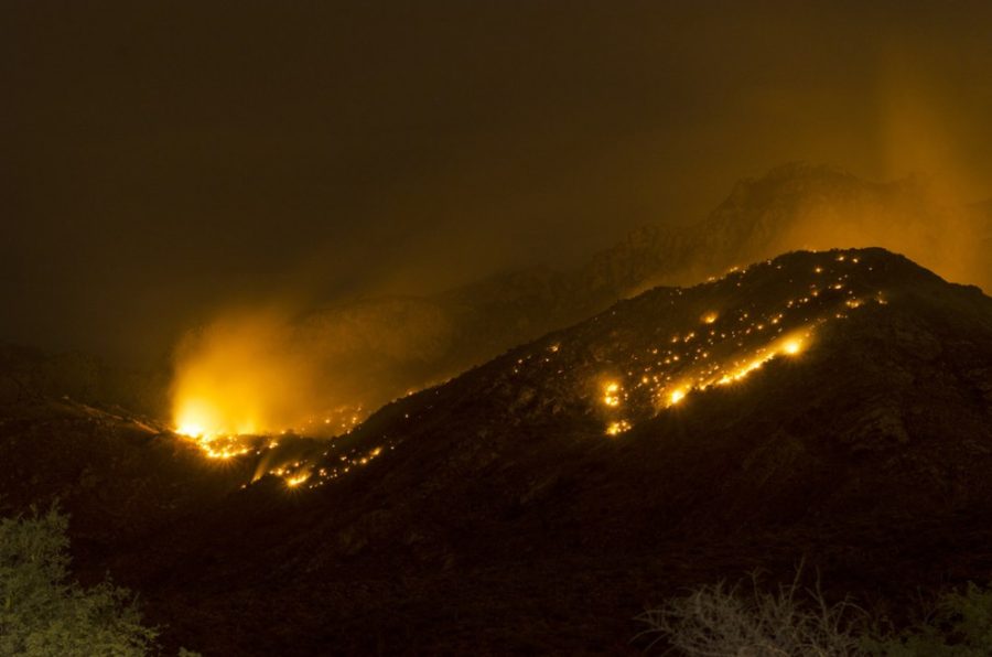 A lightning-caused wildfire burns across patches of Catalina State Park and burns off excess vegetation in the area. Original photo taken July 15, 2015
