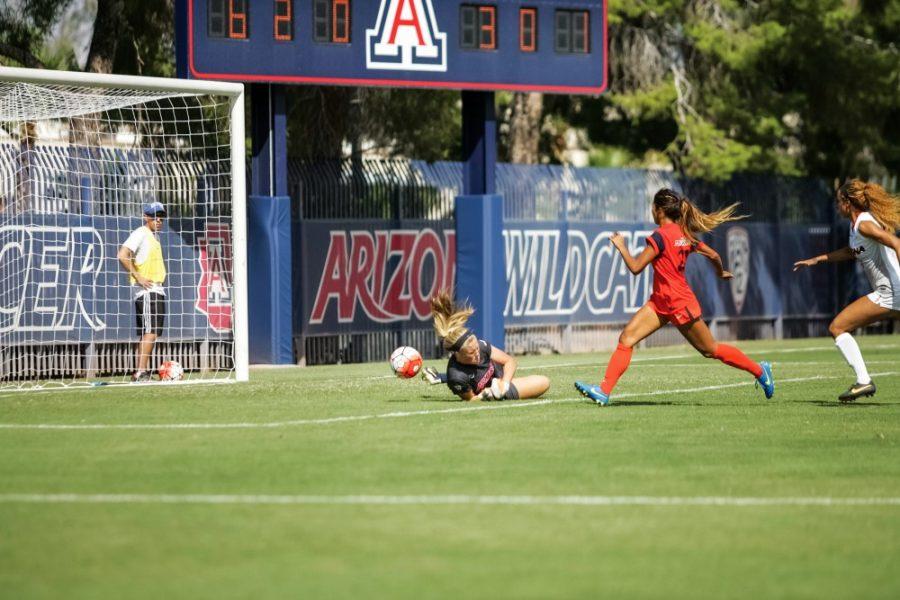 Arizona+goal+keeper+Lainey+Burdett+%281%29+dives+to+block+a+shot+by+Pepperdine+unsuccessfully+on+Sunday.