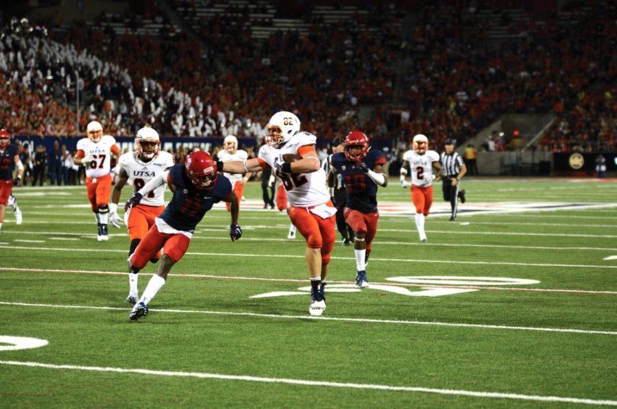 Arizona safety Will Parks (11) goes for a tackle against UTSA at Arizona Stadium on Thursday, Sept. 3. The game against UTSA ended 42-32, the Wildcats first win of the year.