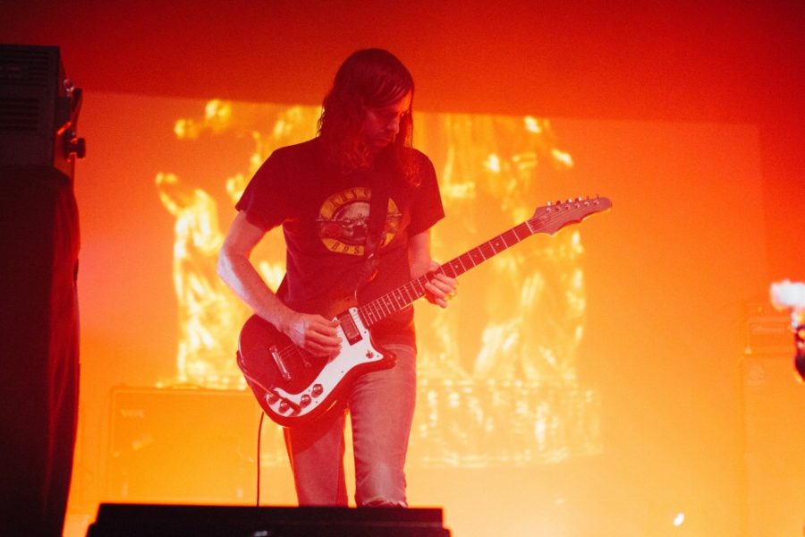 Ratatat guitarist Mike Stround strums his guitar during their set at The Rialto on Sept. 25.