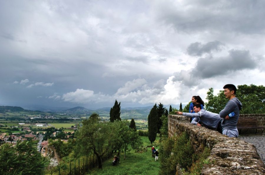 From left to right, Olivia Haddad, Sean Horan, and Khas Ochir look out from the edge of Orvieto, Italy on Saturday, May 23, 2015. The had arrived in Orvieto the day prior for the annual Arizona in Italy summer study abroad program through the University of Arizona. (Photograph by Alex McIntyre)