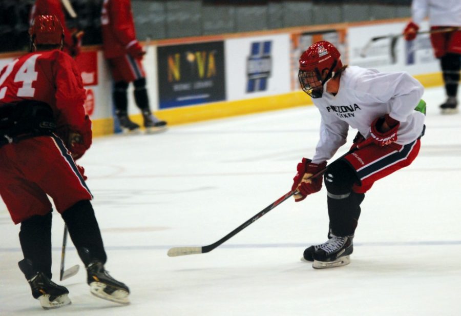 Arizona hockey forward Brian Hogan (6) practices with his teammates on Wednesday, Oct. 7. Hogan and the Wildcats are 2-1 to open the season. 