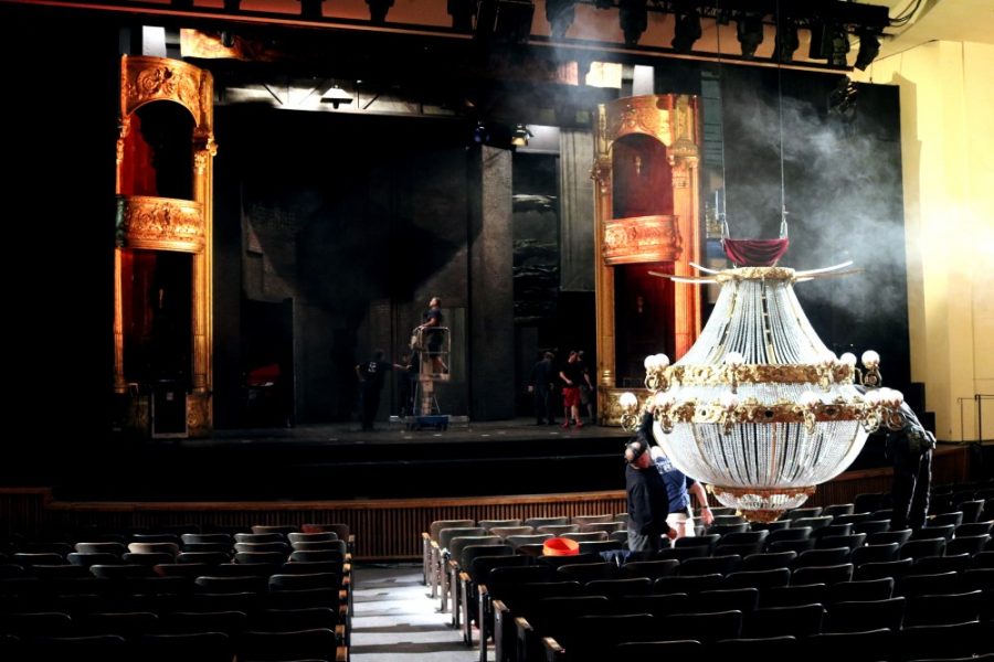The+Phantom+crew+makes+sure+the+chandelier+is+ready+for+the+show+Thursday%2C+Oct.+22.++In+this+production+of+the+show%2C+the+chandelier+is+equipped+with+pyrotechnics+and+is+able+to+move%2C+giving+the+show+a+new+feel+and+making+the+chandelier+a+character+in+itself.