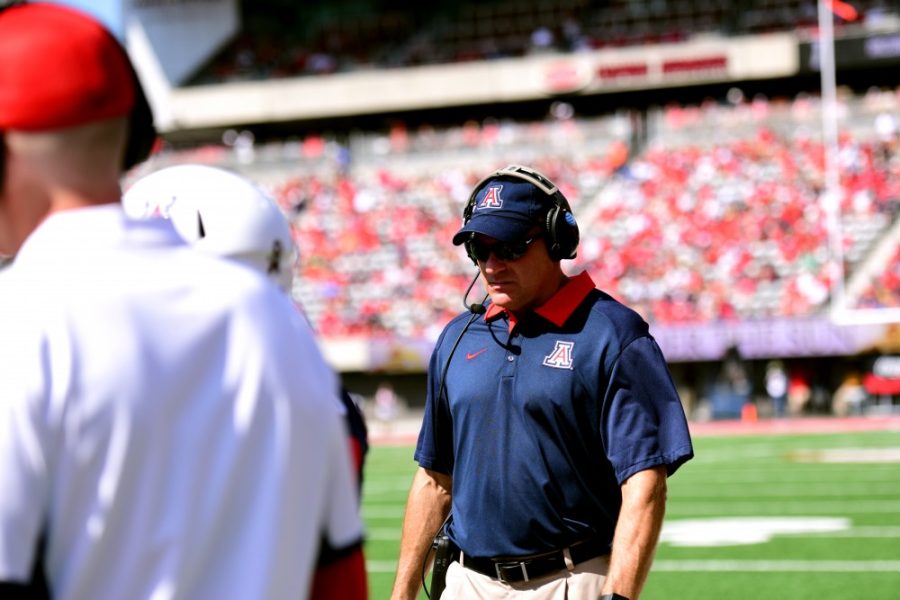 <p>Coach Rich Rodriguez walks the field during the Wildcats' game against OSU this past Saturday, Oct. 10. The Wildcats defeated OSU 44-7.</p>