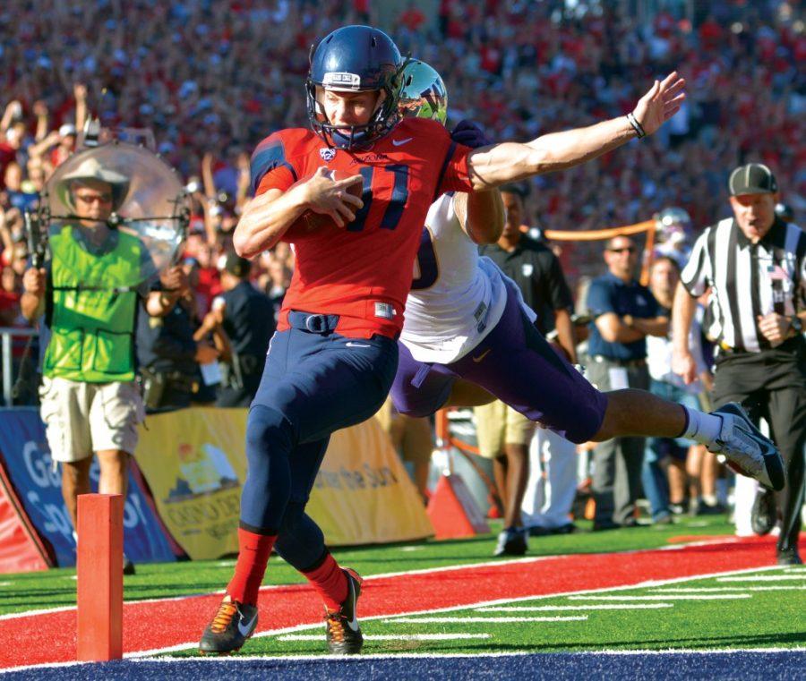 Arizona+kicker+Casey+Skowron+%2841%29+prances+into+the+endzone+at+Arizona+Stadium+during+the+Wildcats+win+over+Washington+on+Saturday%2C+Nov.+11%2C+2014.+The+multifaceted+kicker+also+made+two+field+goals+in+the+27-26+win+over+the+Huskies.