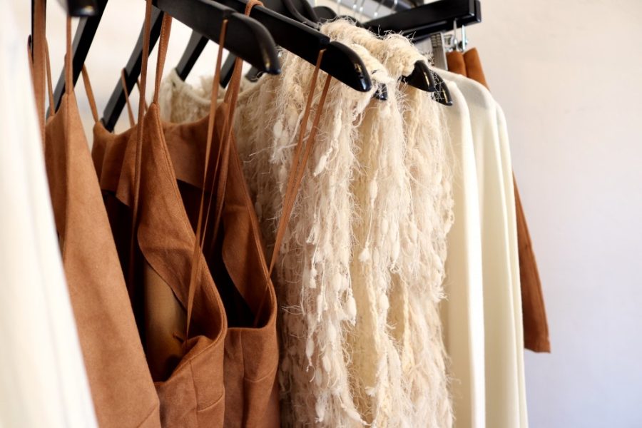 An assortment of neutrally-toned garments adorn a rack in PRVT Residence, a local boutique, on Tuesday, Sept. 29. The shop is located at 634 N Fourth Ave. 