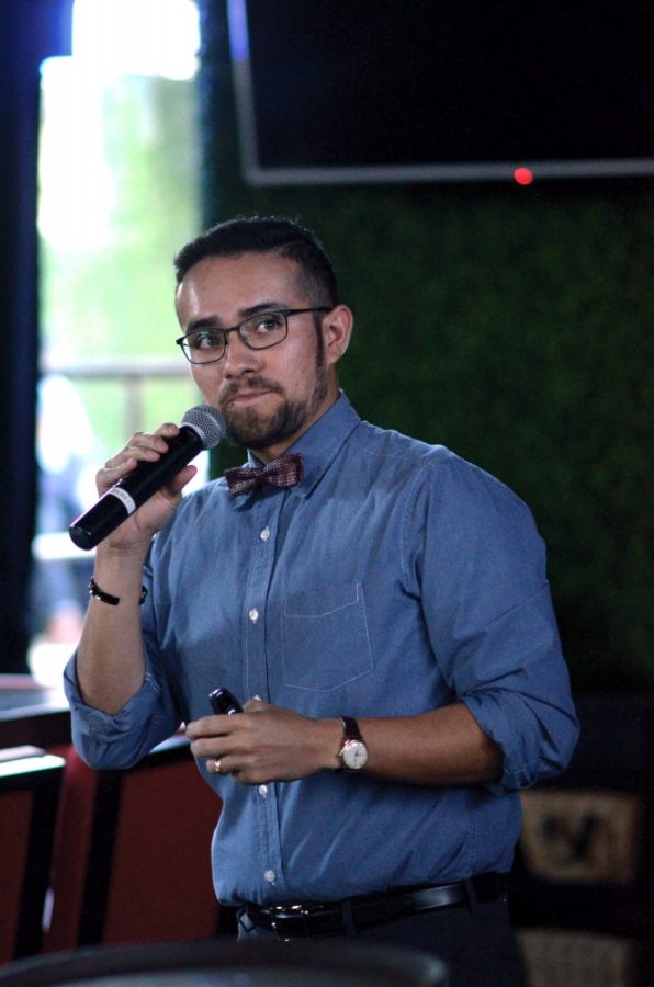 Edward Polanco, a doctoral student of history in the College of Social and Behavioral Sciences, presents his research at The Playground Bar and Lounge during a Grad Slam event Wednesday, April 15. Polanco is a Fulbright scholar currently in Mexico conducting research.