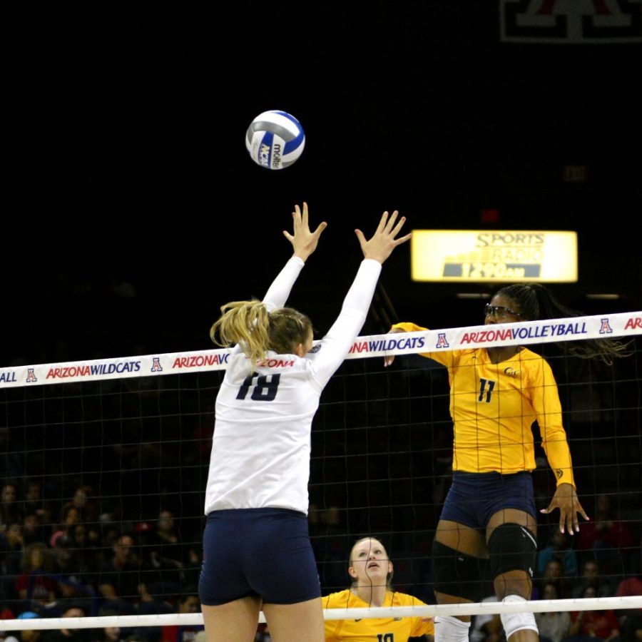 Middle blocker McKenzie Jacobson (18) leaps and misses a block on Friday, Oct. 2. Arizona will look to sharpen its game in the second half of Pac-12 Conference play to get back into conference contention.