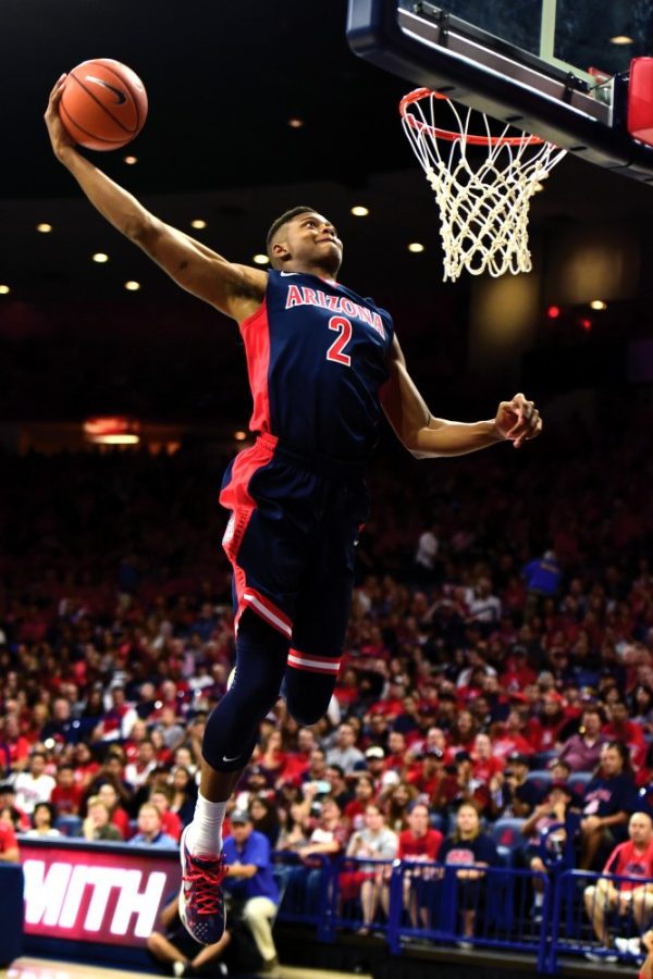 <p>Arizona forward Ray Smith (2) prepares to slam a dunk in McKale Center on Saturday, Oct. 17, during the Red-Blue Game's dunk contest. Smith suffered a season-ending knee injury late last week after recovering from a torn ACL he suffered in the summer of 2014.</p>